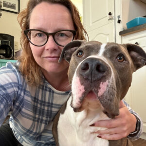 woman taking a selfie with a dog